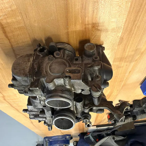 Looking down the secondary bore. Butterfly closed. Note the brass fittings on the side of the body.