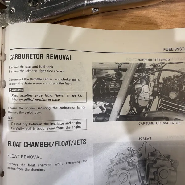 Carburetor Removal and Float Chamber pages. Note the warning about not prying between the insulator and the engine.