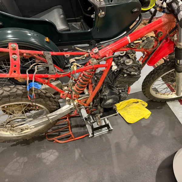 End of the day: bike on the lift, front end mostly bare, next to its garage mates.