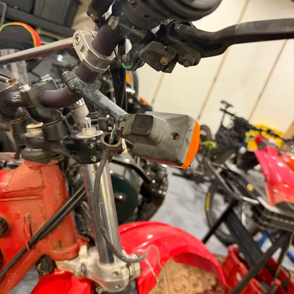 Right signal from the rider's side showing how the stalk bolts to the stay and where the wire enters.