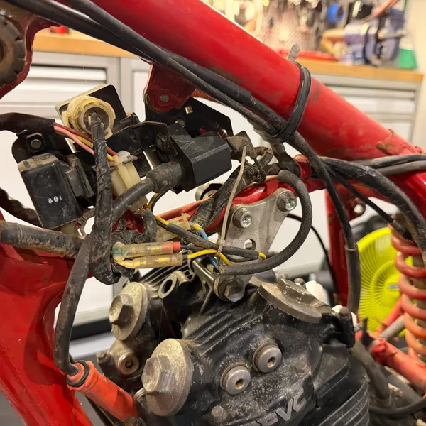 Closer on the connectors behind the steering head. Note which colors pair up before unplugging.